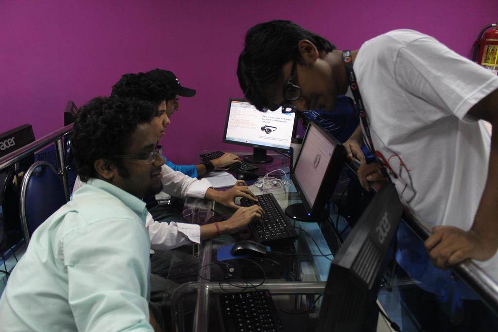 Volunteers and facilitators helping the participants
